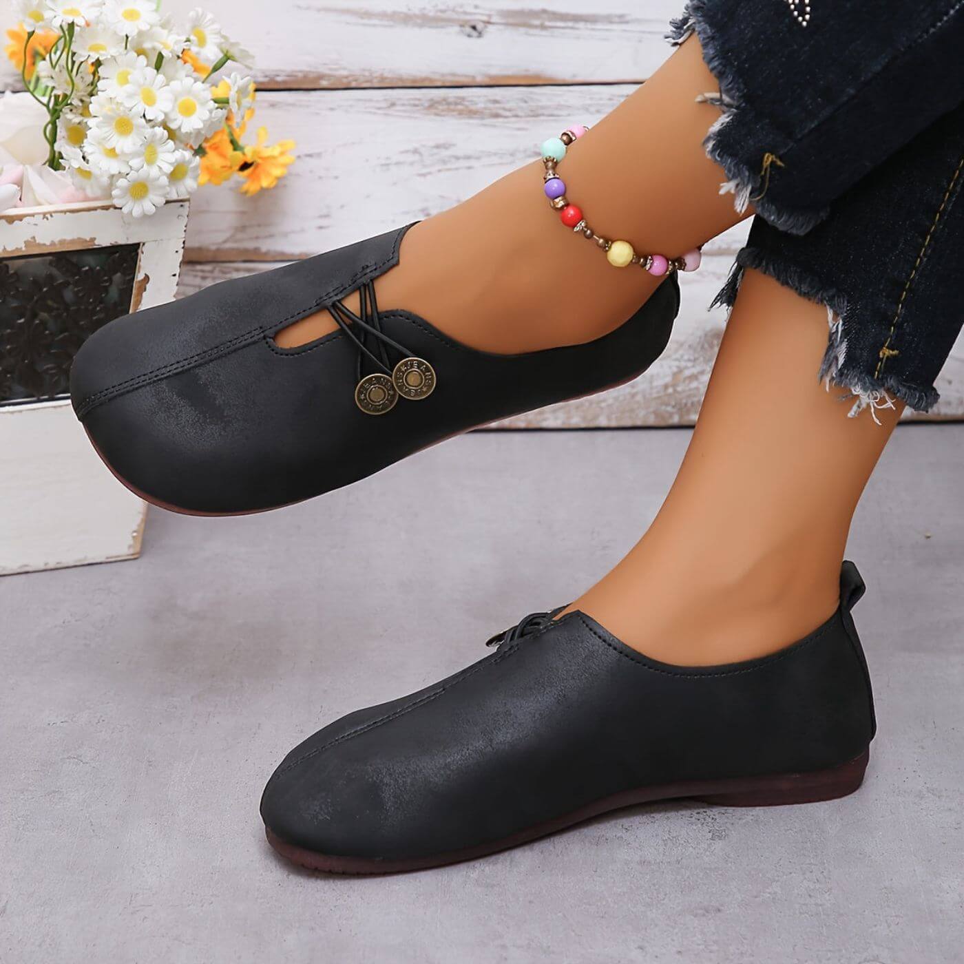 Eleganta ballerinas med dekorativa knappar